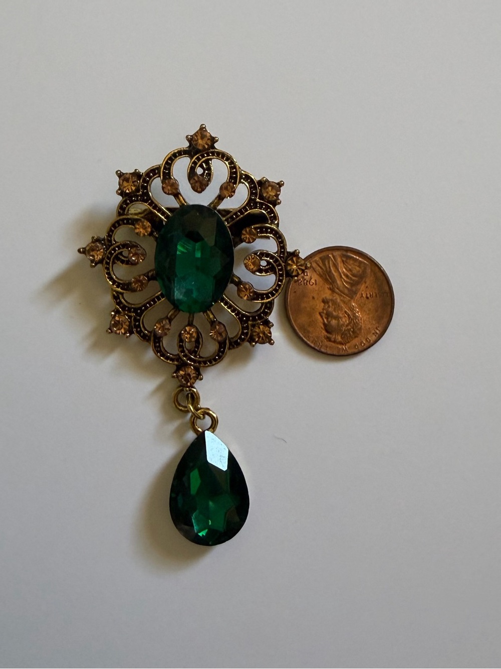 Green stone brooch